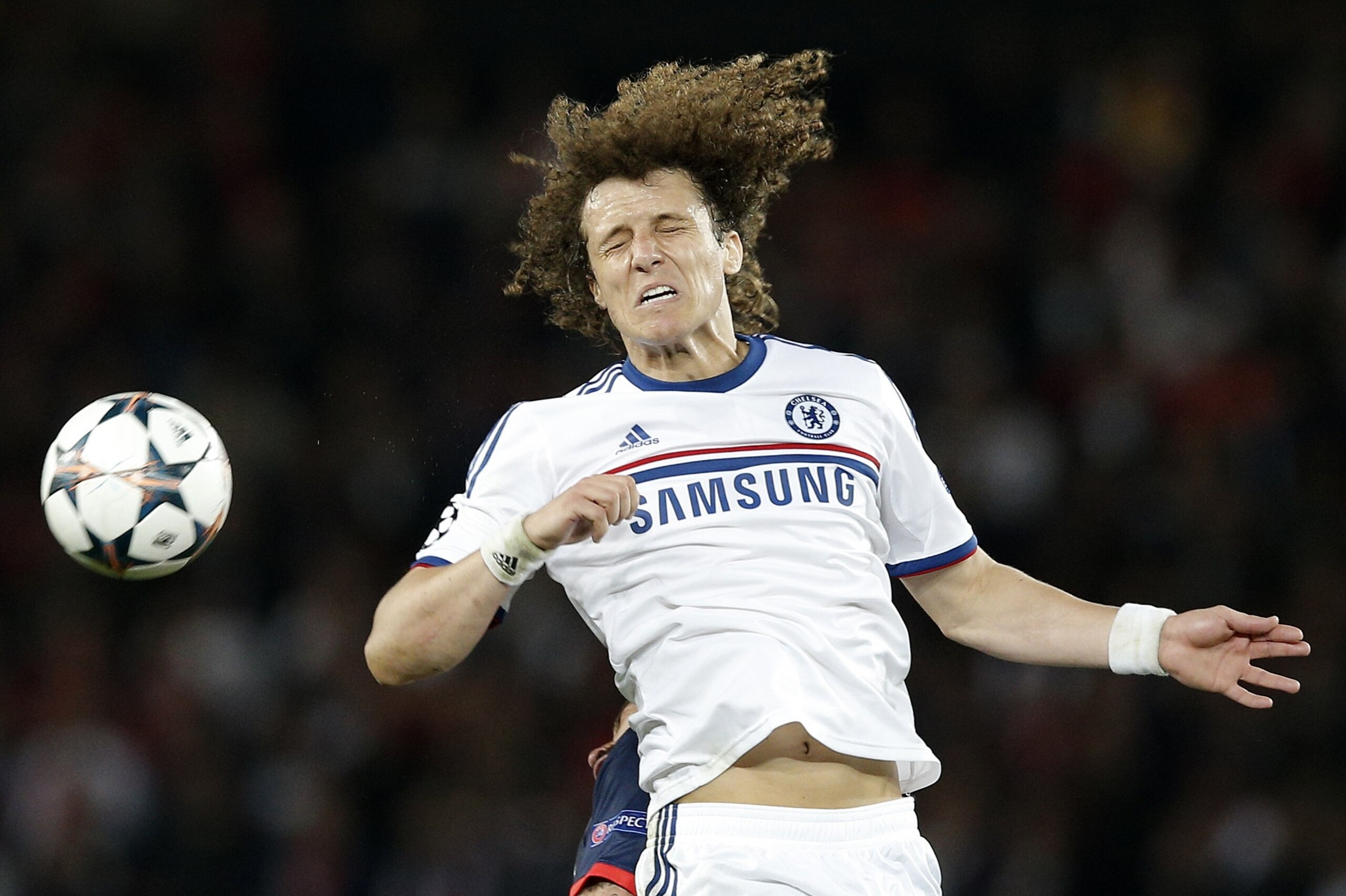 Chelsea's David Luiz contests a header during the Champions League quarterfinal first leg soccer match between PSG and Chelsea, at the Parc des Princes stadium, in Paris, Wednesday, April 2, 2014. (AP Photo/Christophe Ena)