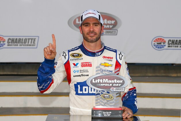 CHARLOTTE, NC - MAY 22:  Jimmie Johnson, driver of the #48 Lowe's Patriotic Chevrolet, celebrates after qualifying for the pole position for the NASCAR Sprint Cup Series Coca-Cola 600 at Charlotte Motor Speedway on May 22, 2014 in Charlotte, North Carolina.  (Photo by Matt Sullivan/Getty Images)