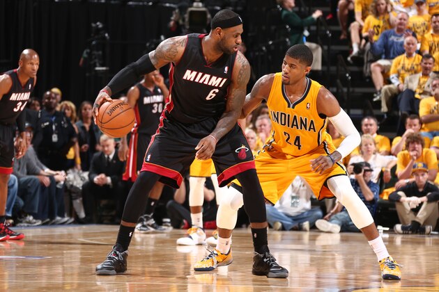 INDIANAPOLIS, IND - MAY 20: LeBron James #6 of the Miami Heat handles the ball against Paul George #24 of the Indiana Pacers in Game Two of the Eastern Conference Finals during the 2014 NBA Playoffs at Bankers Life Fieldhouse on May 20, 2014 in Indianapolis, Indiana. NOTE TO USER: User expressly acknowledges and agrees that, by downloading and or using this Photograph, user is consenting to the terms and condition of the Getty Images License Agreement. Mandatory Copyright Notice: 2014 NBAE (Photo by Nathaniel S. Butler/NBAE via Getty Images)