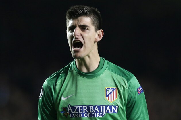 Atletico goalkeeper Thibaut Courtois celebrates as his teammate Atletico's Diego Costa scores his sides second goal from the penalty sport during the Champions League semifinal second leg soccer match between Chelsea and Atletico Madrid at Stamford Bridge stadium in London, Wednesday, April 30, 2014. (AP Photo/Matt Dunham)