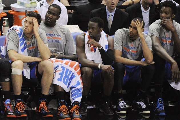Oklahoma City Thunder players sit on the bench in the closing minutes of Game 2 of a Western Conference finals NBA basketball playoff series against the San Antonio Spurs, Wednesday, May 21, 2014, in San Antonio. San Antonio won 112-77. (AP Photo/Darren Abate)