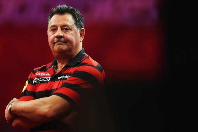 LONDON, ENGLAND - DECEMBER 19:  Dennis Preistley of England reacts during his match against Ronnie Baxter during day 6 of the 2013 Ladbrokes.com World Darts Championship at Alexandra Palace on December 19, 2012 in London, England.  (Photo by Bryn Lennon/Getty Images)