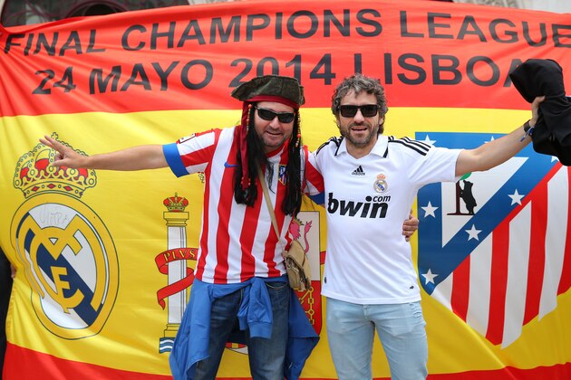 LISBON, PORTUGAL - MAY 24:  Real Madrid and Atletico de Madrid supporters gather in the city centre ahead of the UEFA Champions League Final between Real Madrid and Atletico de Madrid on May 24, 2014 in Lisbon, Portugal.  (Photo by Alex Livesey/Getty Images)