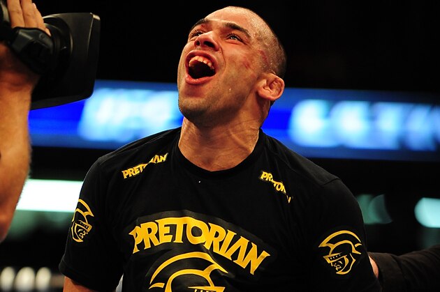 Jul 21, 2012; Calgary, AB, CANADA; Renan Barao celebrates defeating Urijah Faber (not pictured) in the interim bantamweight title bout of UFC 149 at the Scotiabank Saddledome. Mandatory Credit: Anne-Marie Sorvin-USA TODAY Sports