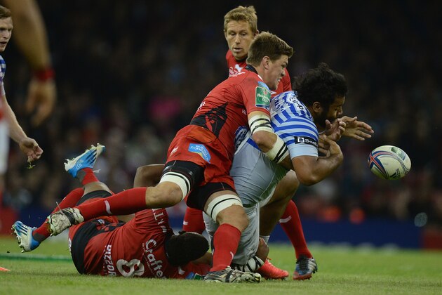 CARDIFF, WALES - MAY 24:  Bakkies Botha of Toulon is tackles by Billy Vunipola of Saracens during the Heineken Cup Final between Toulon and Saracens at the Millennium Stadium on May 24, 2014 in Cardiff, Wales.  (Photo by Jamie McDonaldGetty Images)