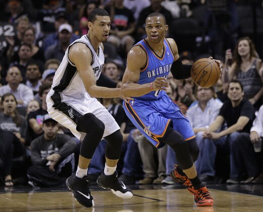 Oklahoma City Thunder's Russell Westbrook (0) drives around San Antonio Spurs' Danny Green (4) during the first half of Game 2 of a Western Conference finals NBA basketball playoff series, Wednesday, May 21, 2014, in San Antonio. (AP Photo/Eric Gay)