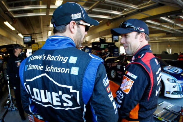 FORT WORTH, TX - NOVEMBER 01:  (L-R) Jimmie Johnson, driver of the #48 Lowe's Chevrolet, and Matt Kenseth, driver of the #20 Home Depot 'Let's Do This' Toyota, talk in the garage area during practice for the NASCAR Sprint Cup Series AAA Texas 500 at Texas Motor Speedway on November 1, 2013 in Fort Worth, Texas.  (Photo by Jeff Zelevansky/Getty Images for Texas Motor Speedway)