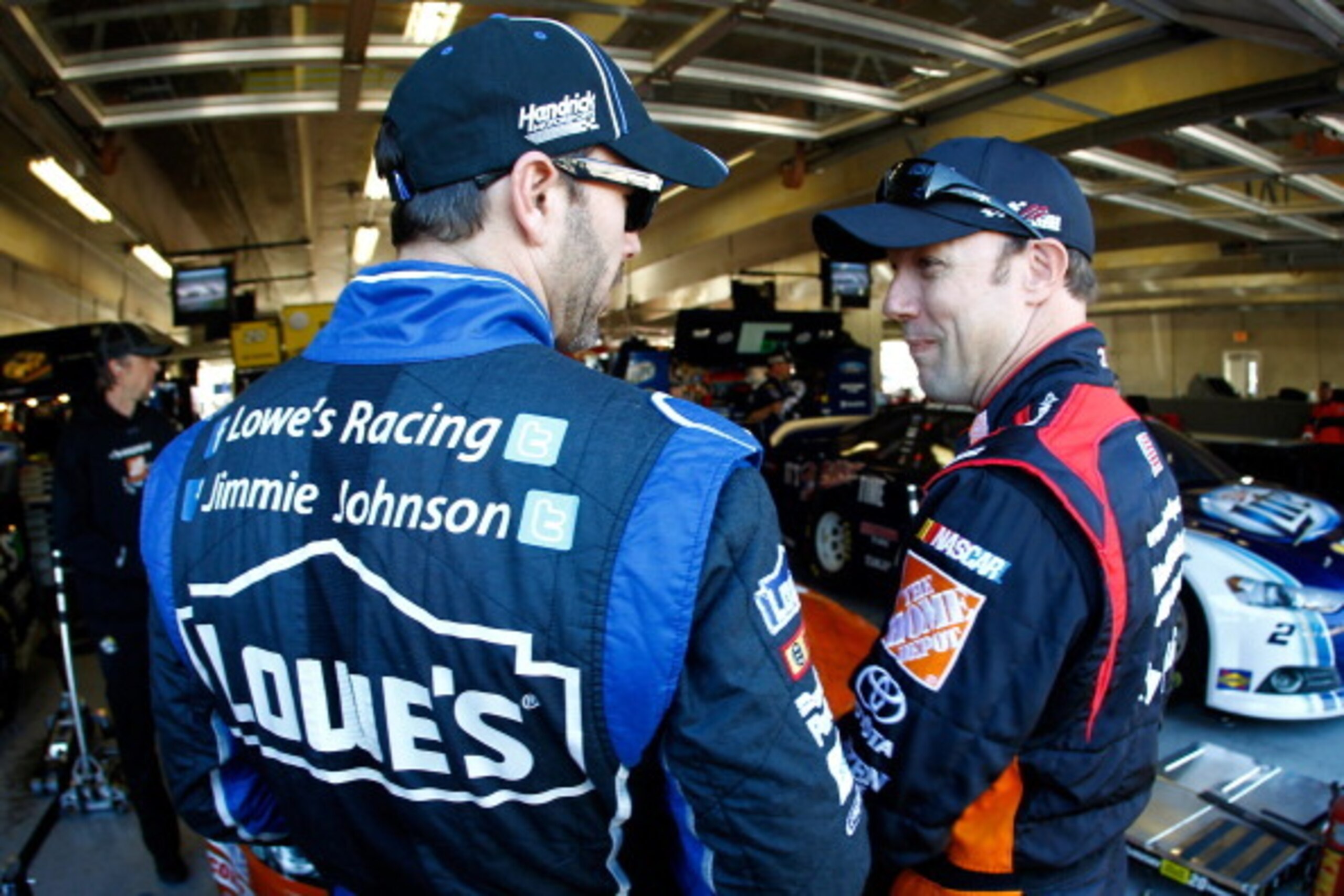 FORT WORTH, TX - NOVEMBER 01:  (L-R) Jimmie Johnson, driver of the #48 Lowe's Chevrolet, and Matt Kenseth, driver of the #20 Home Depot 'Let's Do This' Toyota, talk in the garage area during practice for the NASCAR Sprint Cup Series AAA Texas 500 at Texas Motor Speedway on November 1, 2013 in Fort Worth, Texas.  (Photo by Jeff Zelevansky/Getty Images for Texas Motor Speedway)
