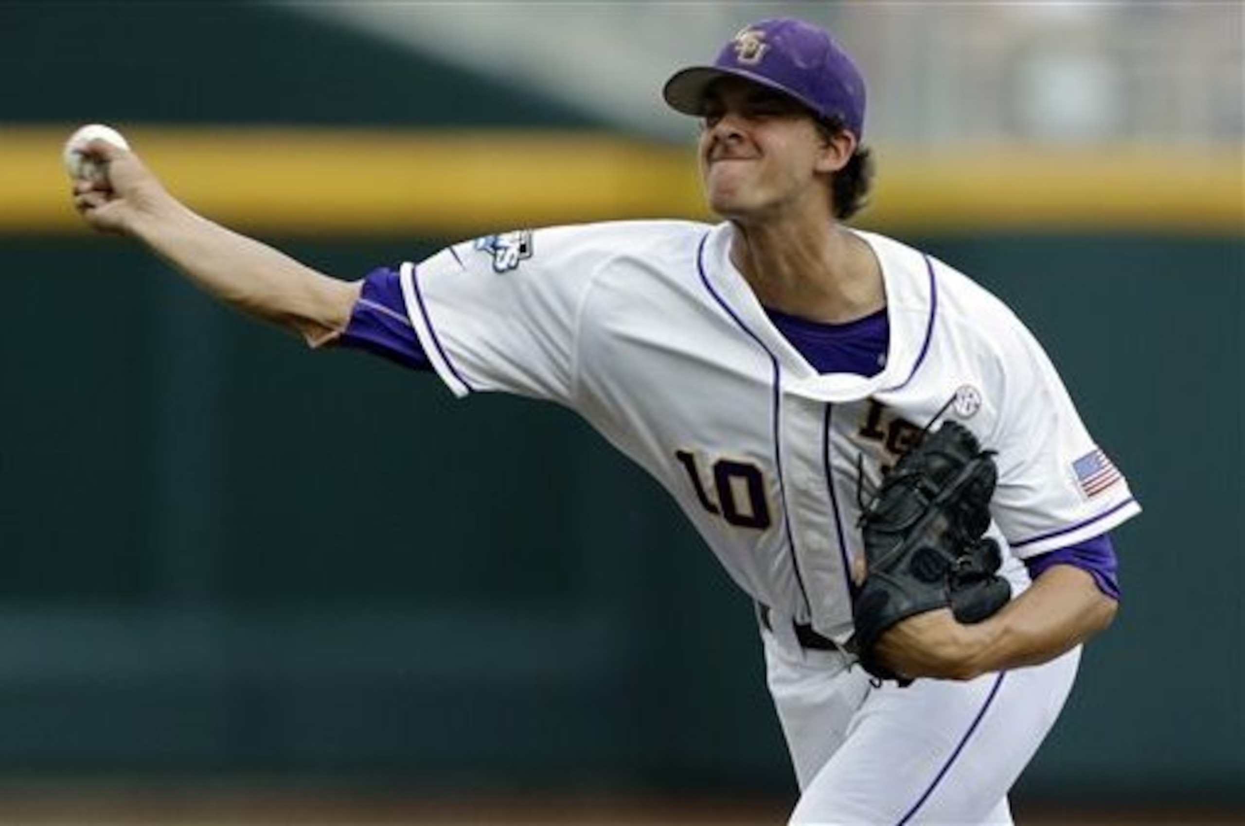 LSU starting pitcher Aaron Nola delivers against UCLA in the first inning of an NCAA College World Series game in Omaha, Neb., Sunday, June 16, 2013. (AP Photo/Nati Harnik)