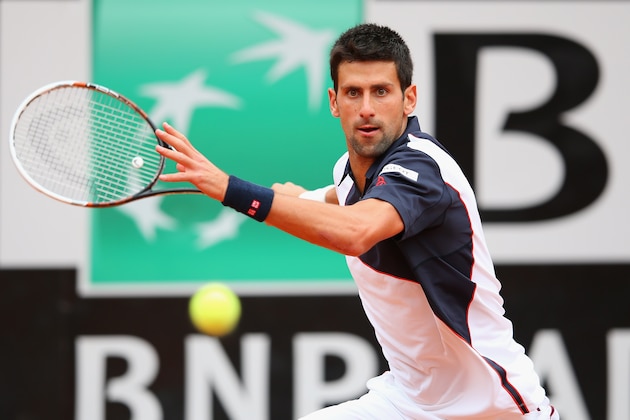 ROME, ITALY - MAY 16:  Novak Djokovic of Serbia in action against David Ferrer of Spain during day six of the Internazionali BNL d'Italia tennis 2014 on May 16, 2014 in Rome, Italy.  (Photo by Julian Finney/Getty Images)
