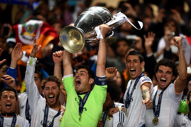 LISBON, PORTUGAL - MAY 24:  Iker Casillas of Real Madrid lifts the Champions League trophy during the UEFA Champions League Final between Real Madrid and Atletico de Madrid at Estadio da Luz on May 24, 2014 in Lisbon, Portugal.  (Photo by Laurence Griffiths/Getty Images)