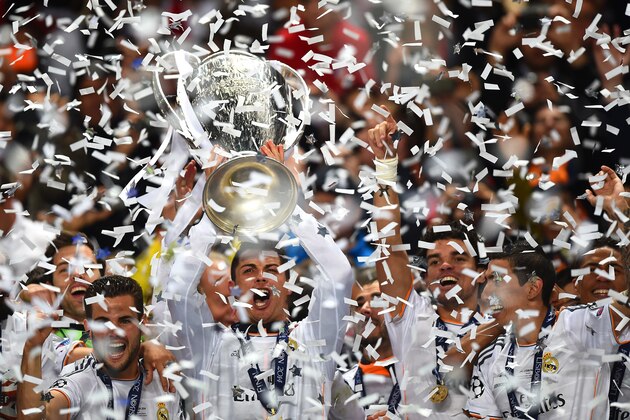 LISBON, PORTUGAL - MAY 24:  Cristiano Ronaldo of Real Madrid lifts the Champions league trophy during the UEFA Champions League Final between Real Madrid and Atletico de Madrid at Estadio da Luz on May 24, 2014 in Lisbon, Portugal.  (Photo by Laurence Griffiths/Getty Images)