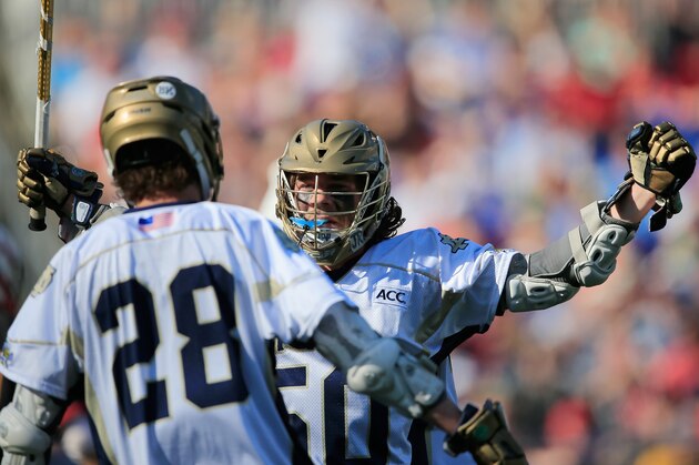 BALTIMORE, MD - MAY 24:  Matt Kavanagh #50 of the Notre Dame Fighting Irish celebrates with teammate Conor Doyle #28 after scoring a second half goal against the Maryland Terrapins during the semifinals of the 2014 NCAA Division I Men's Lacrosse Championship at M&T Bank Stadium on May 24, 2014 in Baltimore, Maryland.  (Photo by Rob Carr/Getty Images)