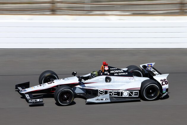 Kurt Busch heads into the first turn on the final day of practice for the Indianapolis 500 IndyCar auto race at the Indianapolis Motor Speedway in Indianapolis, Friday, May 23, 2014. The 98th running of the Indianapolis 500 is Sunday. (AP Photo/Tom Strattman)