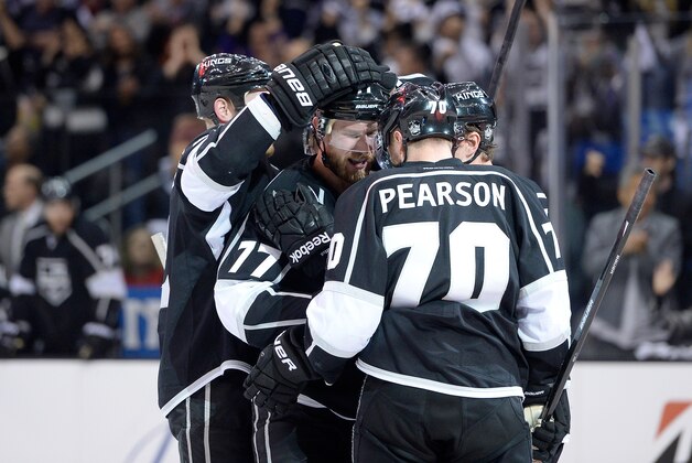 LOS ANGELES, CA - MAY 24:  Jeff Carter #77 and Tyler Toffoli #73 of the Los Angeles Kings celebrate after Carter scores a second period goal against the Chicago Blackhawks in Game Three of the Western Conference Final during the 2014 Stanley Cup Playoffs at Staples Center on May 24, 2014 in Los Angeles, California.  (Photo by Harry How/Getty Images)