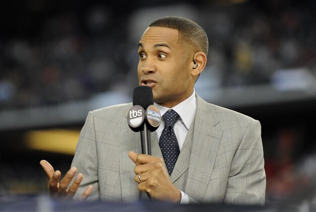 Apr 5, 2014; Arlington, TX, USA; TBS broadcaster Grant Hill on air during the semifinals of the Final Four in the 2014 NCAA Mens Division I Championship tournament between the Florida Gators and Connecticut Huskies at AT&T Stadium. Mandatory Credit: Sean Dougherty-USA TODAY Sports
