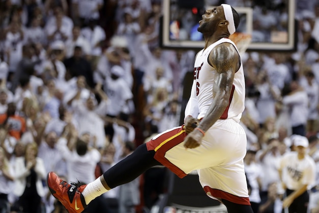 Miami Heat forward LeBron James celebrates late in the second half of Game 3 in the NBA basketball Eastern Conference finals playoff series against the Indiana Pacers, Saturday, May 24, 2014, in Miami. The Heat defeated the Pacers 99-87. (AP Photo/Lynne Sladky)