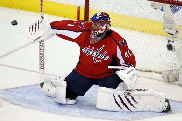 Washington Capitals goalie Jaroslav Halak (41), from the Czech Republic, deflects a shot in the third period of an NHL hockey game against the Chicago Blackhawks, Friday, April 11, 2014, in Washington. The Capitals won 4-0. (AP Photo/Alex Brandon)