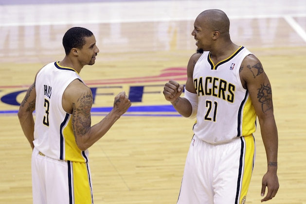 Indiana Pacers guard George Hill, left, and forward David West celebrate late in the fourth quarter of Game 6 of the Eastern Conference semifinal NBA basketball playoff series against the New York Knicks in Indianapolis, Saturday, May 18, 2013. The Pacers defeated the Knicks 106-99 to win the series 4-2. (AP Photo/Michael Conroy)