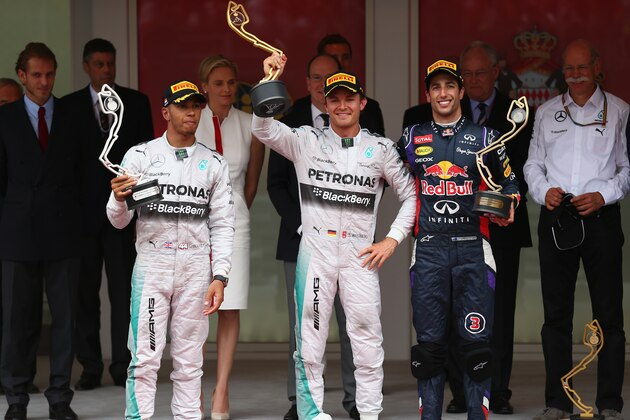 MONTE-CARLO, MONACO - MAY 25:  (L-R) Lewis Hamilton (2nd place) of Great Britain and Mercedes GP, Nico Rosberg (1st place) of Germany and Mercedes GP and Daniel Ricciardo (3rd place) of Australia and Infiniti Red Bull Racing pose on the podium following  the Monaco Formula One Grand Prix at Circuit de Monaco on May 25, 2014 in Monte-Carlo, Monaco.  (Photo by Clive Mason/Getty Images)