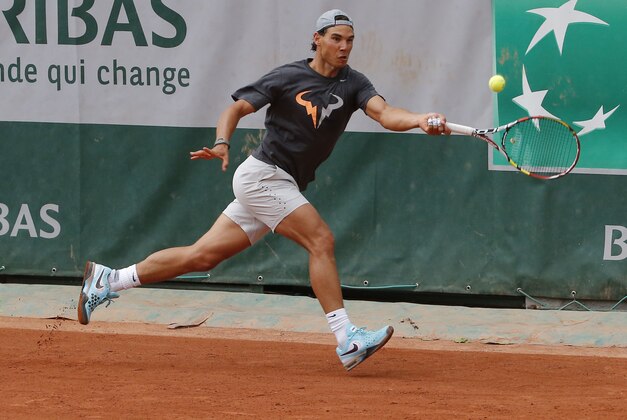 Spain's Rafael Nadal, prepares to serve the ball during a training session for the French Open tennis tournament, at the Roland Garros stadium in Paris, Saturday, May 24, 2014. The French Open tennis tournament starts Sunday. (AP Photo/Michel Euler)