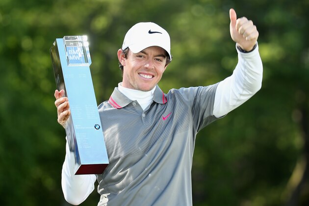 VIRGINIA WATER, ENGLAND - MAY 25:  Rory McIlroy of Northern Ireland poses with the trophy following his victory at the end of day four of the BMW PGA Championship at Wentworth on May 25, 2014 in Virginia Water, England.  (Photo by Richard Heathcote/Getty Images)