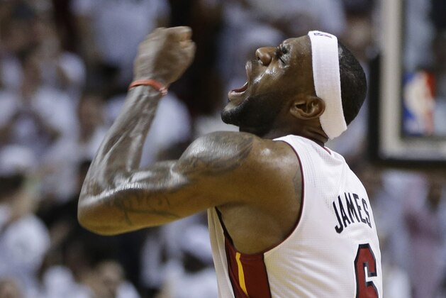 Miami Heat forward LeBron James celebrates late in the second half of Game 3 in the NBA basketball Eastern Conference finals playoff series against the Indiana Pacers, Saturday, May 24, 2014, in Miami. The Heat defeated the Pacers 99-87. (AP Photo/Lynne Sladky)