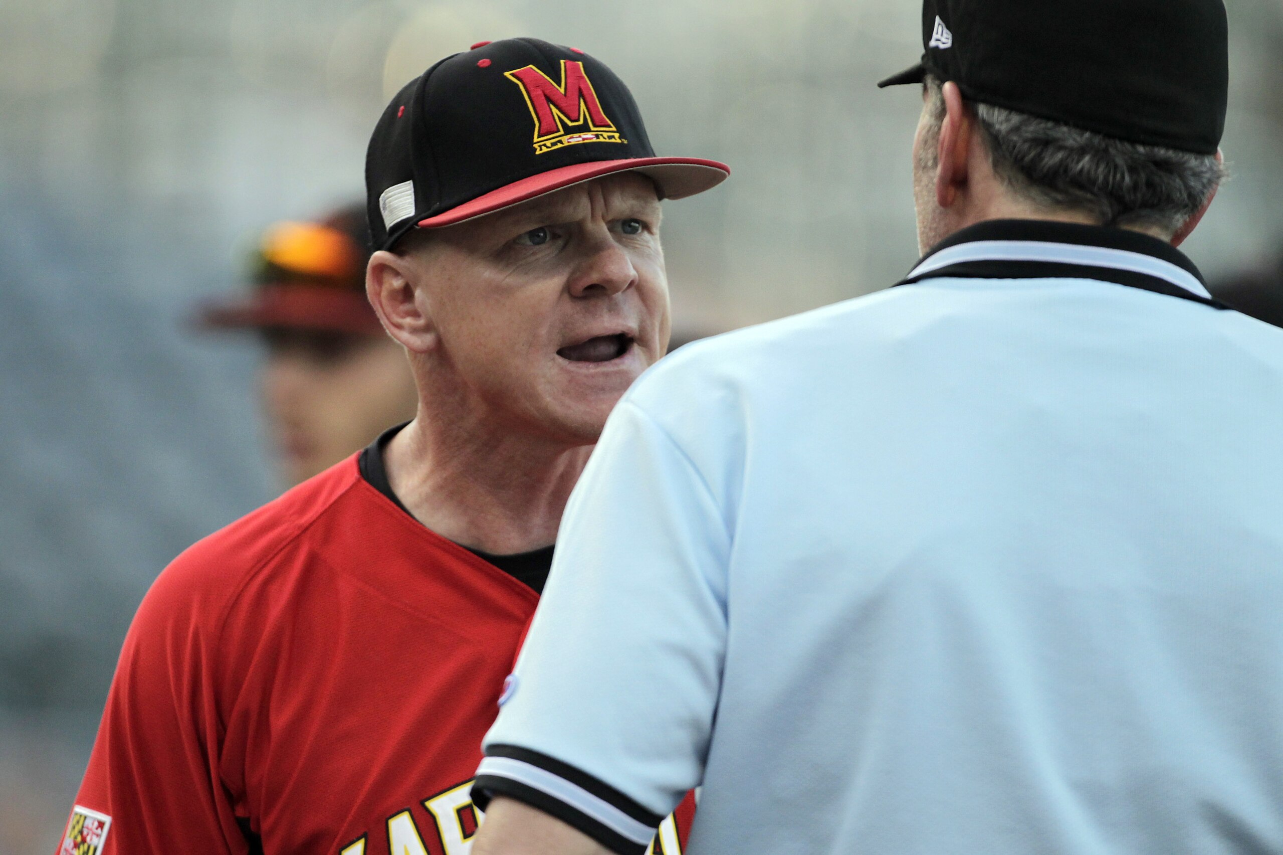 Maryland coach John Szefc argues a call at the plate during the start of the six-run eighth inning for North Carolina in an Atlantic Coast Conference college baseball tournament game in Greensboro, N.C., Saturday, May 24, 2014. North Carolina won 13-7. (AP Photo/Bob Leverone)