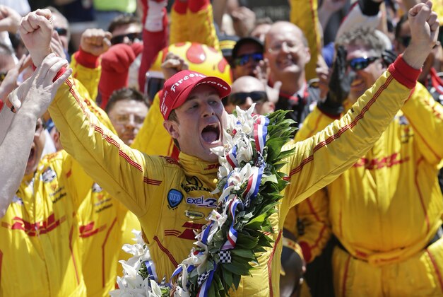 Ryan Hunter-Reay celebrates winning the 98th running of the Indianapolis 500 IndyCar auto race at the Indianapolis Motor Speedway in Indianapolis, Sunday, May 25, 2014. (AP Photo/AJ Mast)