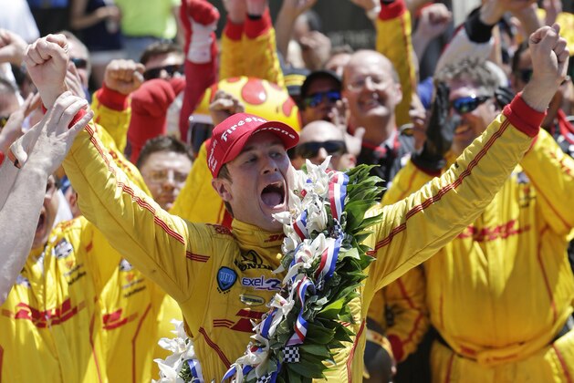 Ryan Hunter-Reay celebrates winning the 98th running of the Indianapolis 500 IndyCar auto race at the Indianapolis Motor Speedway in Indianapolis, Sunday, May 25, 2014. (AP Photo/AJ Mast)