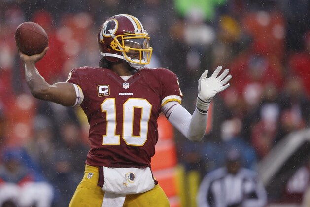 Washington Redskins quarterback Robert Griffin III passes the ball during the second half of an NFL football game against the Kansas City Chiefs in Landover, Md., Sunday, Dec. 8, 2013. (AP Photo/Evan Vucci)
