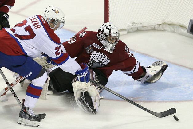 LONDON, ON - MAY 25: Curtis Lazar #27 of the Edmonton Oil Kings misses the net against Justin Nichols #39 of the Guelph Storm during the second period during the 2014 Memorial Cup championship game at Budweiser Gardens on May 25, 2014 in London, Ontario, Canada.  (Photo by Bruce Bennett/Getty Images)