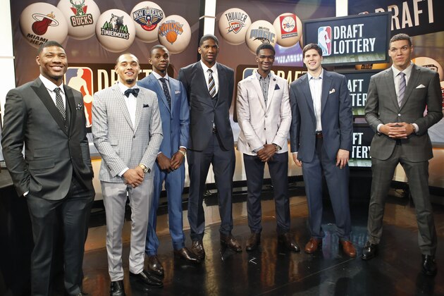 From left, NBA draft prospects Marcus Smart of Oklahoma State, Tyler Ennis of Syracuse, Andrew Wiggins and Joel Embiid of Kansas, Noah Vonleh of Indiana, Doug McDermott of Creighton and Aaron Gordon of Arizona pose for a photograph before the NBA basketball draft lottery in New York, Tuesday, May 20, 2014. (AP Photo/Kathy Willens)