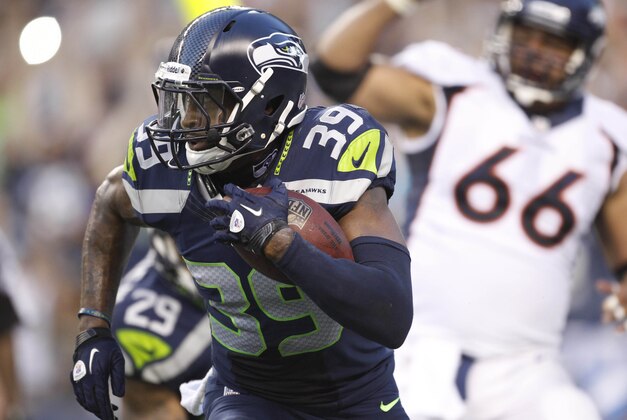 Aug 17, 2013; Seattle, WA, USA; Seattle Seahawks cornerback Brandon Browner (39) returns a fumble 106 yards for a touchdown against the Denver Broncos during the second quarter at CenturyLink Field. Mandatory Credit: Joe Nicholson-USA TODAY Sports