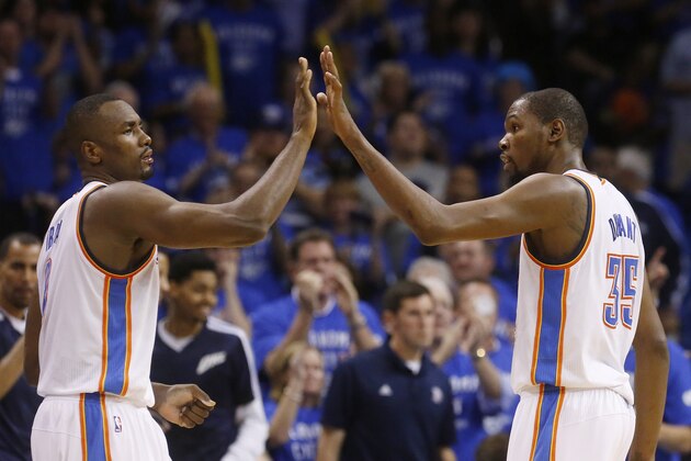 Oklahoma City Thunder forward Serge Ibaka (9) and forward Kevin Durant (35) exchange high-fives in the fourth quarter of Game 3 of an NBA basketball playoff series in the Western Conference finals against the San Antonio Spurs, Sunday, May 25, 2014, in Oklahoma City. Oklahoma City won 106-97. Durant scored 25 points and 10 rebounds. Ibaka had 15 points. (AP Photo/Sue Ogrocki)