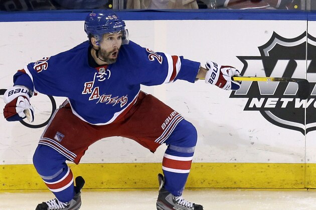 New York Rangers' Martin St. Louis celebrates his game-winning goal during overtime in Game 4 of the NHL hockey Stanley Cup playoffs Eastern Conference finals against the Montreal Canadiens, Sunday, May 25, 2014, in New York. The Rangers defeated the Canadiens in overtime 3-2. (AP Photo/Seth Wenig)