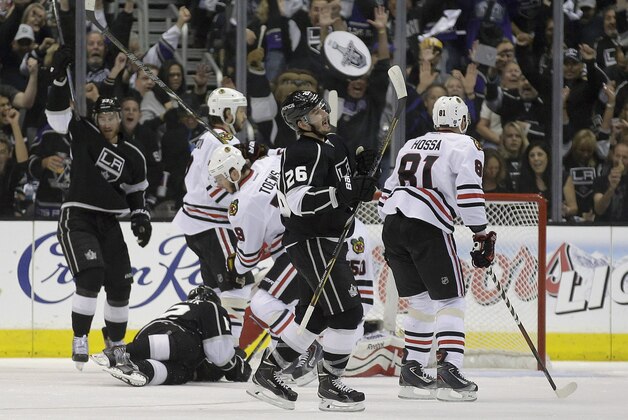 Los Angeles Kings defenseman Slava Voynov (26) celebrates his goal against the Chicago Blackhawks during the first period of Game 3 of the Western Conference finals of the NHL hockey Stanley Cup playoffs in Los Angeles, Saturday, May 24, 2014. (AP Photo/Chris Carlson)
