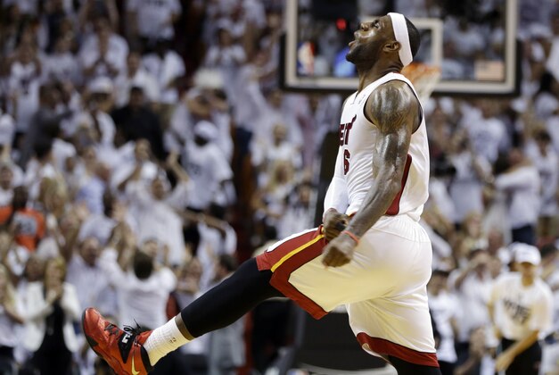 Miami Heat forward LeBron James celebrates late in the second half of Game 3 in the NBA basketball Eastern Conference finals playoff series against the Indiana Pacers, Saturday, May 24, 2014, in Miami. The Heat defeated the Pacers 99-87. (AP Photo/Lynne Sladky)