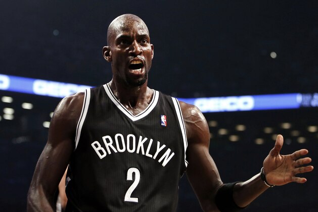 Brooklyn Nets' Kevin Garnett talks to a referee during an NBA basketball game against the Miami Heat, Friday, Nov. 1, 2013, in New York. Brooklyn defeated Miami, 101-100. (AP Photo/Jason DeCrow)