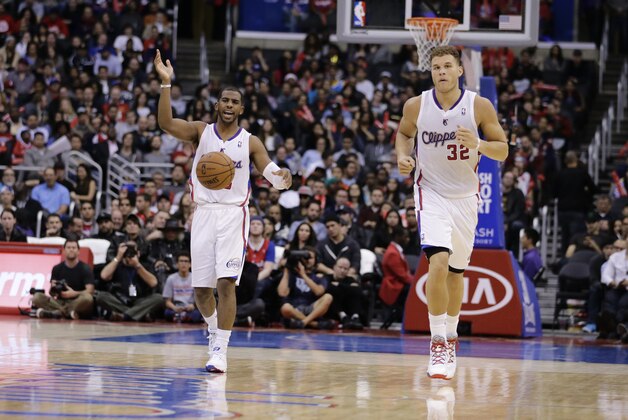 Los Angeles Clippers' Chris Paul, left, and Los Angeles Clippers' Blake Griffin make their way down the court during the second half of an NBA basketball game against the New Orleans Pelicans on Wednesday, Dec. 18, 2013, in Los Angeles. The Clippers won 108-95. (AP Photo/Jae C. Hong)