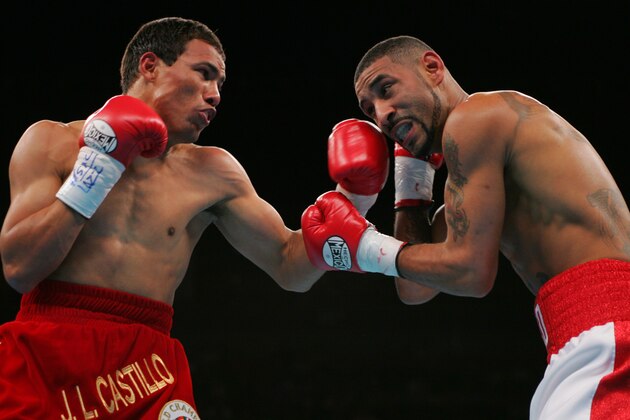 WBC lightweight champion Jose Luis Castillo, left, of Mexico, lands a left to the face of WBO lightweight champion Diego Corrales, of Sacramento, Calif., in the first round of their unification bout on Saturday, May 7, 2005, at the Mandalay Bay Events Center in Las Vegas. (AP Photo/Eric Jamison)