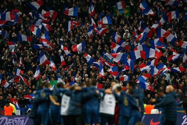 PARIS, FRANCE - NOVEMBER 19: French fans celebrate after their side won the FIFA 2014 World Cup Qualifier 2nd Leg Playoff between France and Ukraine at the Stade de France on November 19, 2013 in Paris, France.  (Photo by Harry Engels/Getty Images)
