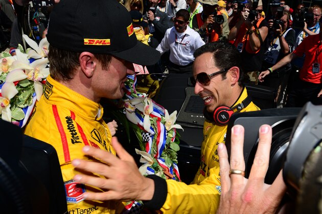INDIANAPOLIS, IN - MAY 25: Ryan Hunter-Reay (left) driver of the #28 Andretti Autosport Dallara Honda hugs Helio Castroneves of Brazil driver of the #3 Team Penske Dallara Chevrolet after the 98th running of the Indianapolis 500 mile race at the Indianapolis Motor Speedway on May 25, 2014 in Indianapolis, Indiana.  (Photo by Robert Laberge/Getty Images)