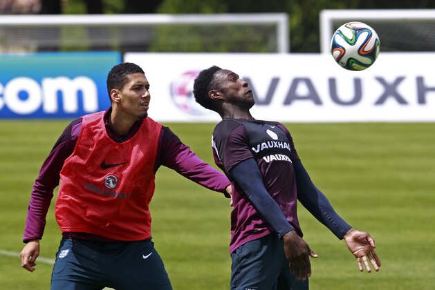 England's Chris Smalling, left, and Danny Welbeck attend a training session in Vale do Lobo, near Almancil, southern Portugal, Wednesday, May 21, 2014. England will play the World Cup in Brazil in Group D with Uruguay, Costa Rica and Italy. (AP Photo/Francisco Seco)