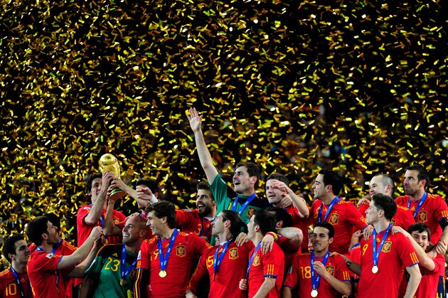 JOHANNESBURG, SOUTH AFRICA - JULY 11:  The Spain team celebrate winning the World Cup as captain Iker Casillas (C) waves to fans during the 2010 FIFA World Cup South Africa Final match between Netherlands and Spain at Soccer City Stadium on July 11, 2010 in Johannesburg, South Africa.  (Photo by Jamie McDonald/Getty Images)