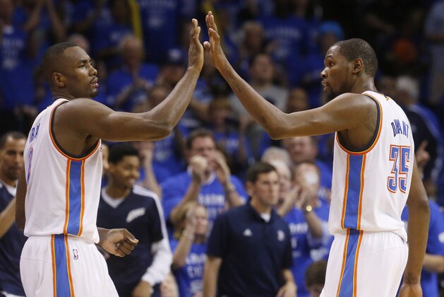 Oklahoma City Thunder forward Serge Ibaka (9) and forward Kevin Durant (35) exchange high-fives in the fourth quarter of Game 3 of an NBA basketball playoff series in the Western Conference finals against the San Antonio Spurs, Sunday, May 25, 2014, in Oklahoma City. Oklahoma City won 106-97. Durant scored 25 points and 10 rebounds. Ibaka had 15 points. (AP Photo/Sue Ogrocki)