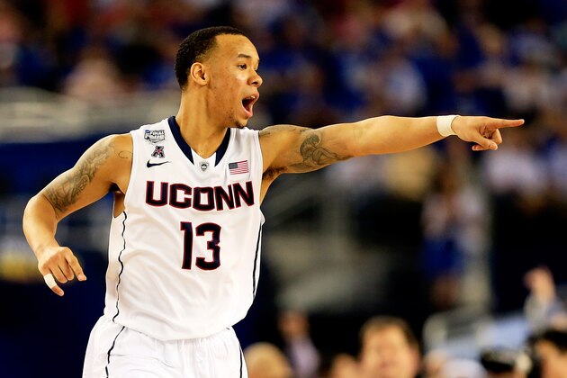 ARLINGTON, TX - APRIL 07: Shabazz Napier #13 of the Connecticut Huskies calls a play against the Kentucky Wildcats during the NCAA Men's Final Four Championship at AT&T Stadium on April 7, 2014 in Arlington, Texas.  (Photo by Jamie Squire/Getty Images)