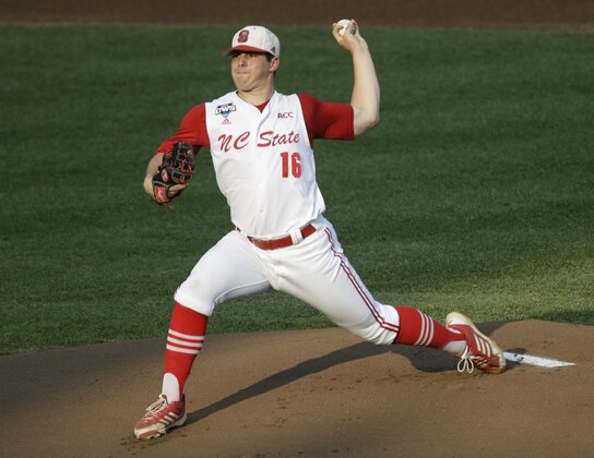 FILE - In this June 20, 2013 file photo, North Carolina State pitcher Carlos Rodon throws against North Carolina during an NCAA College World Series elimination baseball game in Omaha, Neb. (AP Photo/Nati Harnik, File)
