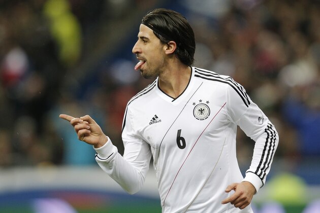 Germany's Sami Khedira celebrates scoring his side's 2nd goal during the soccer friendly match between France and Germany in the Stade de France in Saint-Denis, north of Paris. Wednesday, Feb.6,2013. (AP Photo/Christophe Ena)