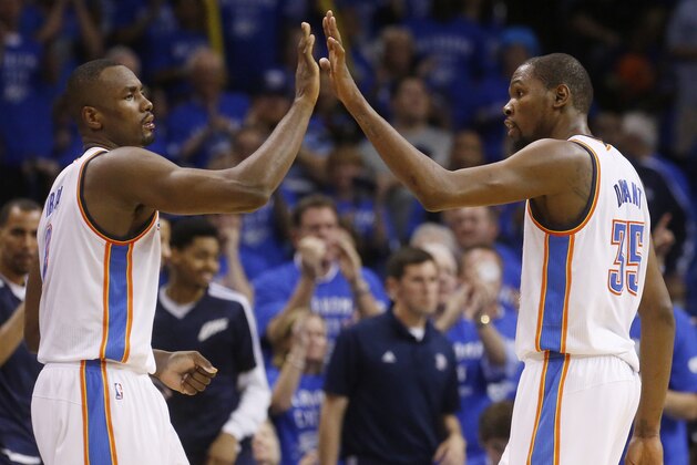 Oklahoma City Thunder forward Serge Ibaka (9) and forward Kevin Durant (35) exchange high-fives in the fourth quarter of Game 3 of an NBA basketball playoff series in the Western Conference finals against the San Antonio Spurs, Sunday, May 25, 2014, in Oklahoma City. Oklahoma City won 106-97. Durant scored 25 points and 10 rebounds. Ibaka had 15 points. (AP Photo/Sue Ogrocki)